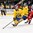 GRAND FORKS, NORTH DAKOTA - APRIL 18: Sweden's Alexander Nylander #11 looks for a scoring chance while teammate Lias Andersson #26 battles with Switzerland's Fabian Berni #9 during preliminary round action at the 2016 IIHF Ice Hockey U18 World Championship. (Photo by Minas Panagiotakis/HHOF-IIHF Images)

